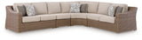 Close-up of beige resin wicker and cushion fabric