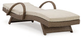 Beachcroft beige outdoor chaise lounge angled side view reclining