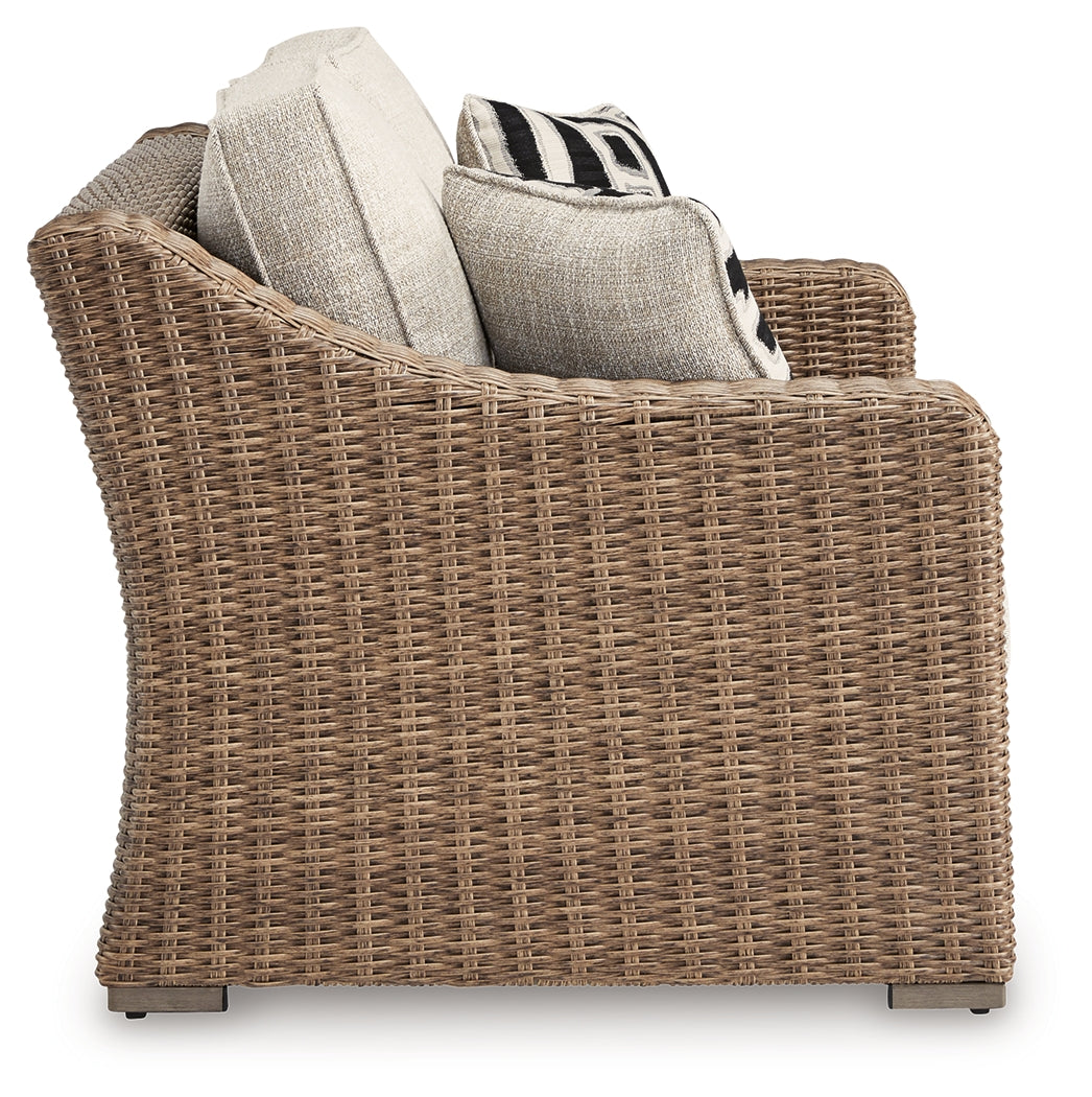 Beachcroft Beige Outdoor Loveseat angle showing arm detail