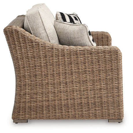 Beachcroft Beige Outdoor Loveseat angle showing arm detail