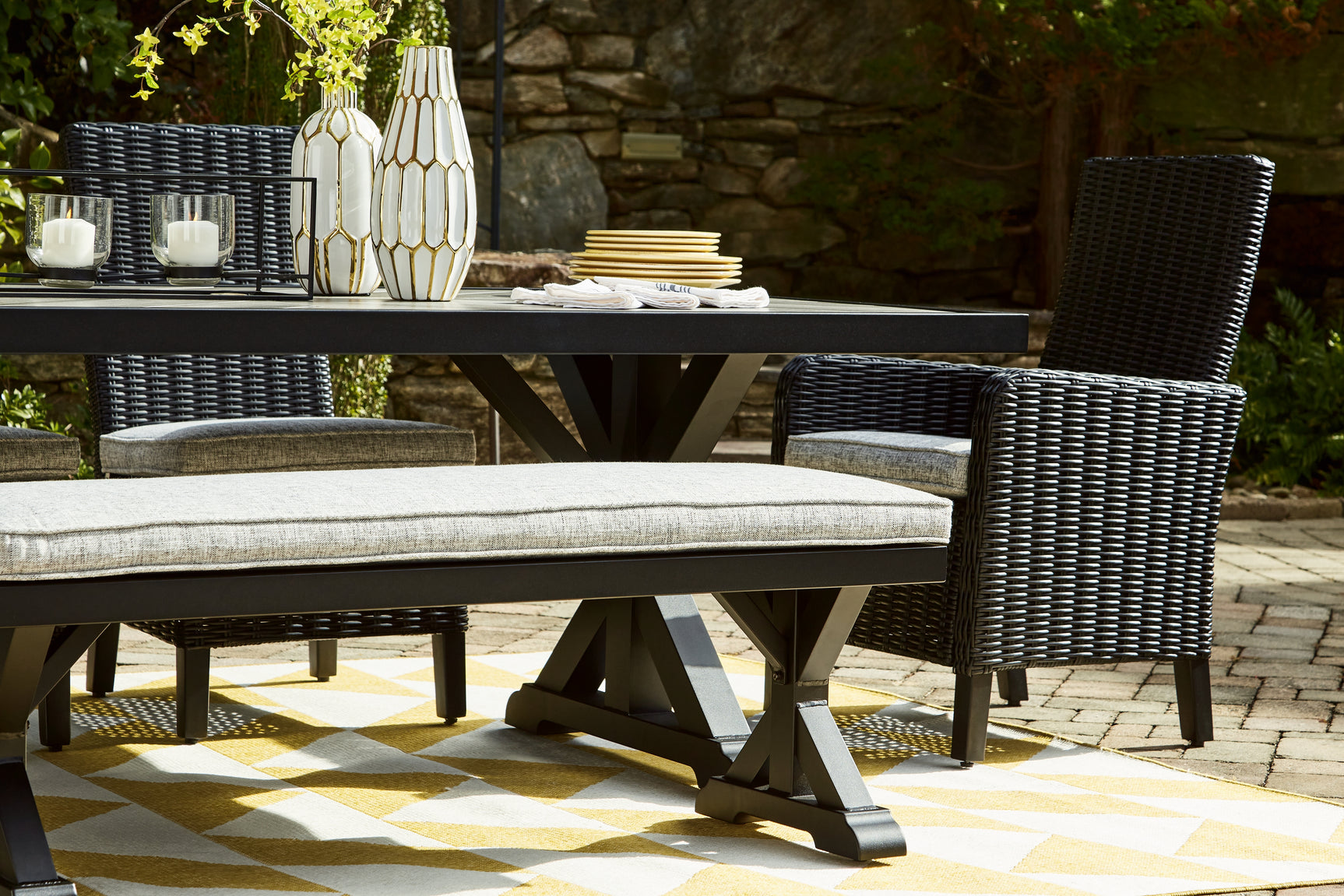 Beachcroft Outdoor Dining Table styled in outdoor setting horizontal