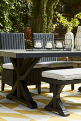 Beachcroft Outdoor Dining Table styled in outdoor setting vertical