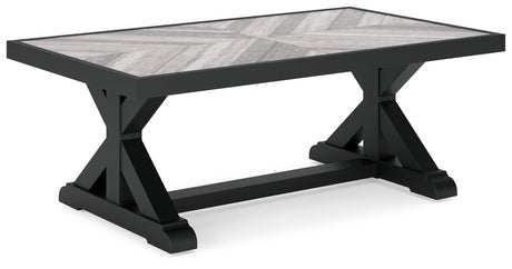 Beachcroft coffee table with glass top in outdoor setting