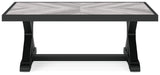 End table with black frame and glass surface, matching Beachcroft sofa set