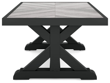 Two Beachcroft end tables next to lounge chairs