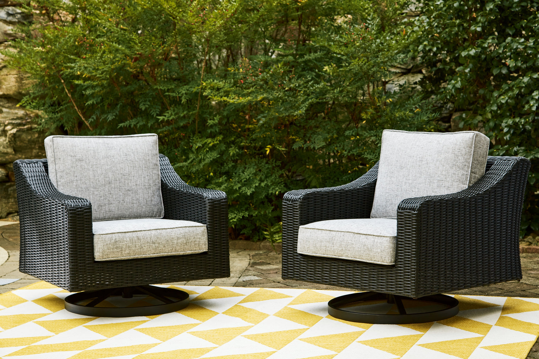 Beachcroft outdoor sofa set with black frame and light gray cushions from front angle