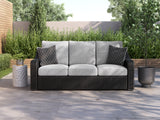 Beachcroft outdoor sofa set with black frame and light gray cushions from front angle
