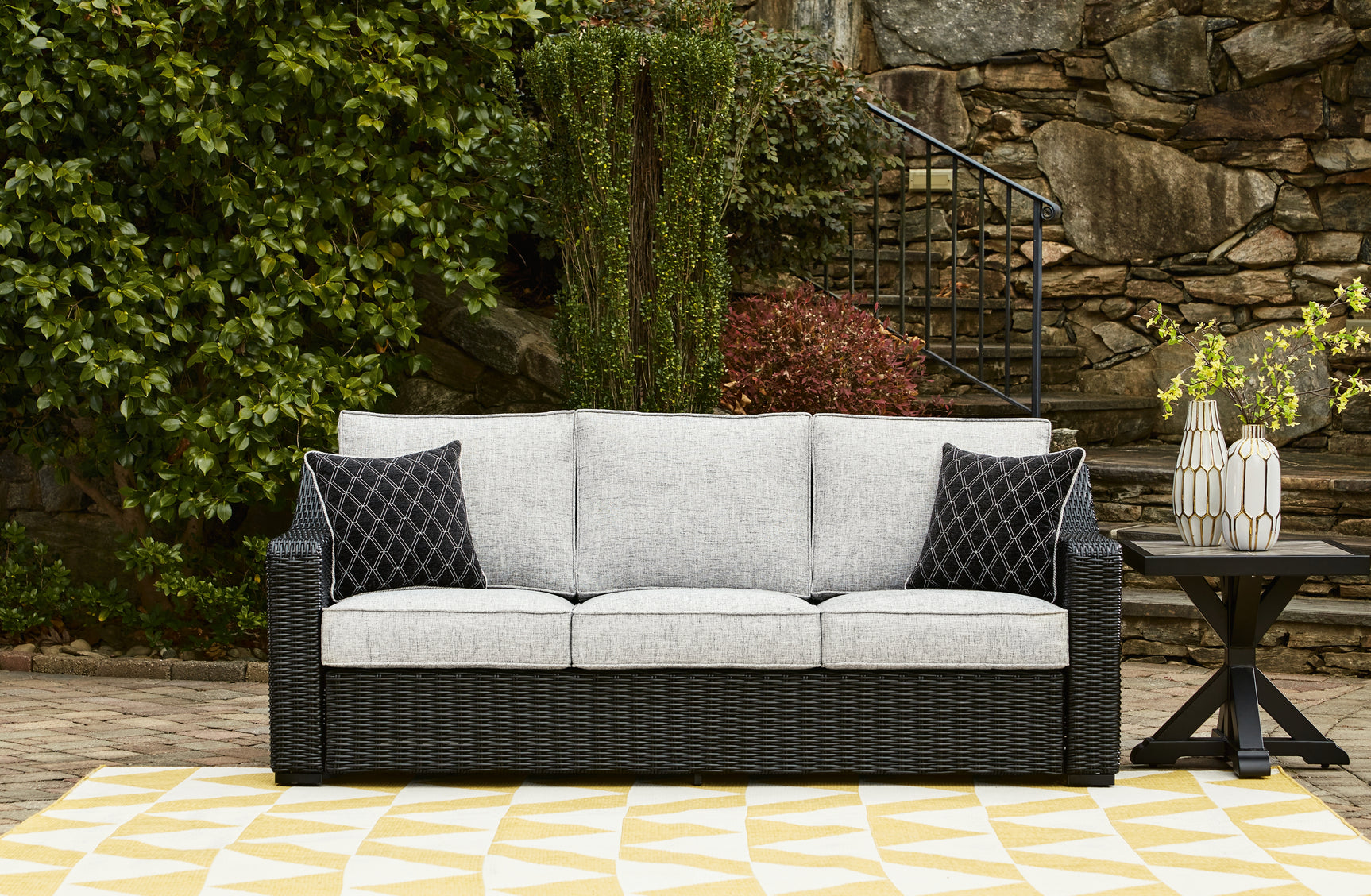 Beachcroft outdoor sofa set with coffee and end tables in black and light gray