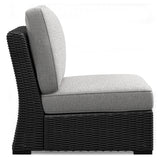 Side angle of the Beachcroft sectional showing resin wicker weave