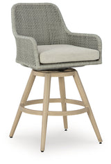 Seton Creek outdoor swivel barstool front view showing cushion and wicker