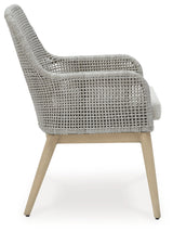 Side view of gray resin wicker chair