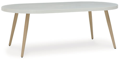 Seton White Creek outdoor dining table with 4 white wicker chairs
