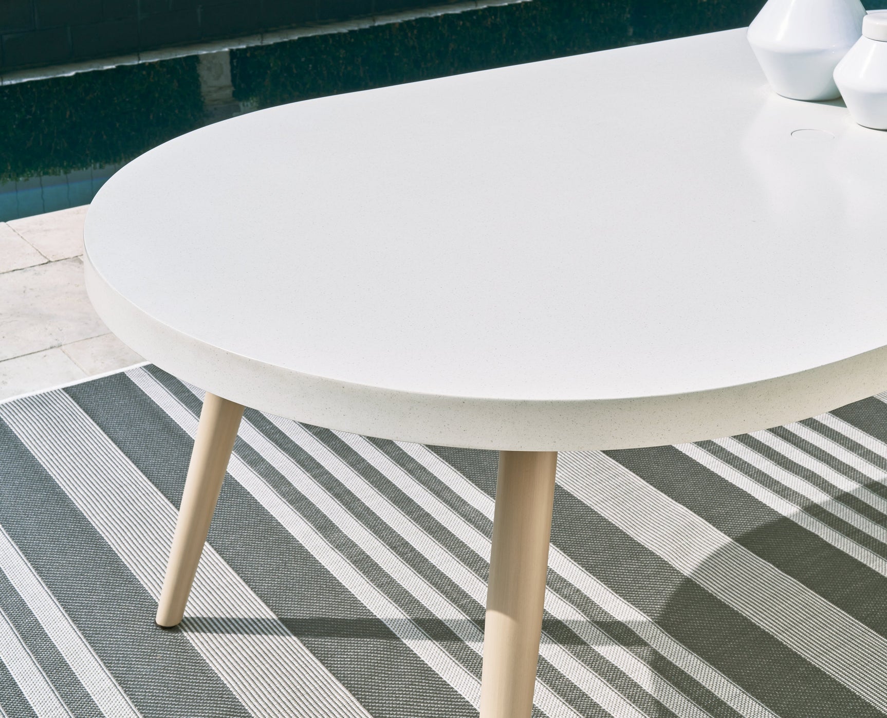 Close-up of Seton Creek White Outdoor Dining Table leg and hardware detail