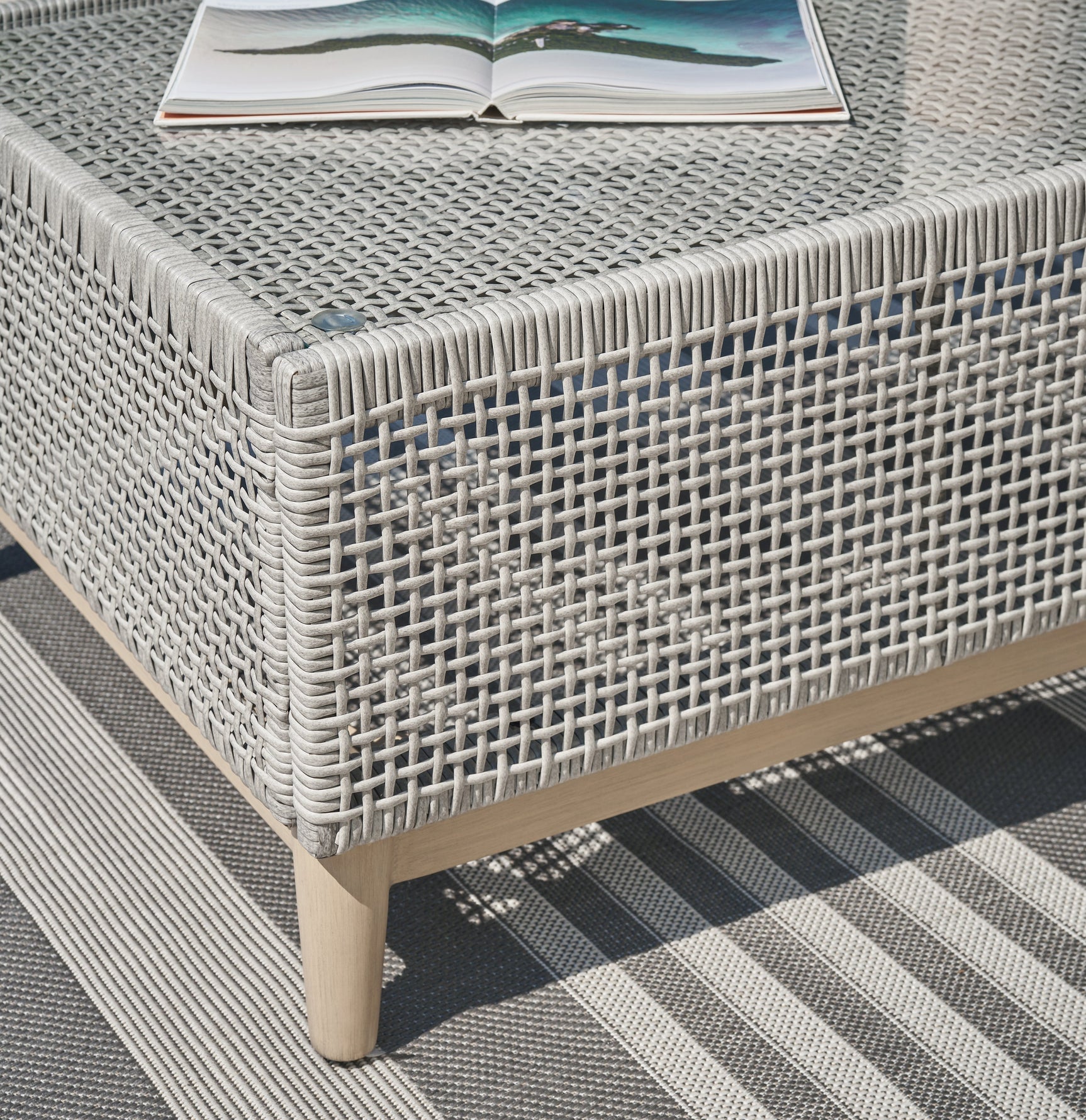 Wood-look painted finish on legs of Seton Creek Outdoor Coffee Table