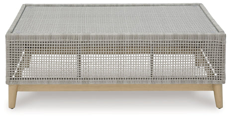Side view of Seton Creek Gray Outdoor Coffee Table showing wood-look painted legs