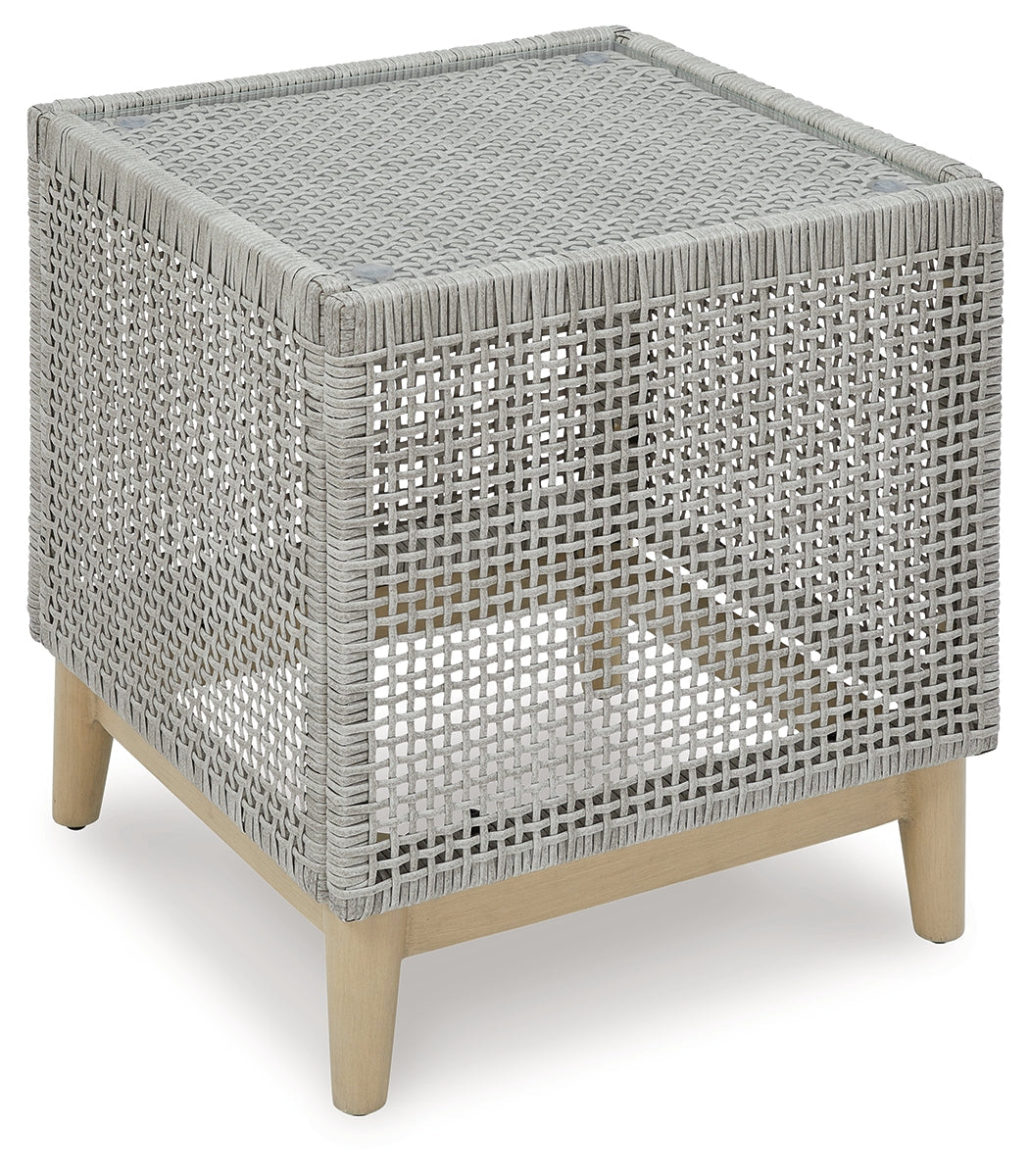 Seton Creek gray outdoor end table, side view showing wood-look painted legs