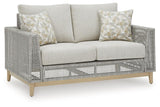 Seton Creek gray outdoor loveseat with cushion side view