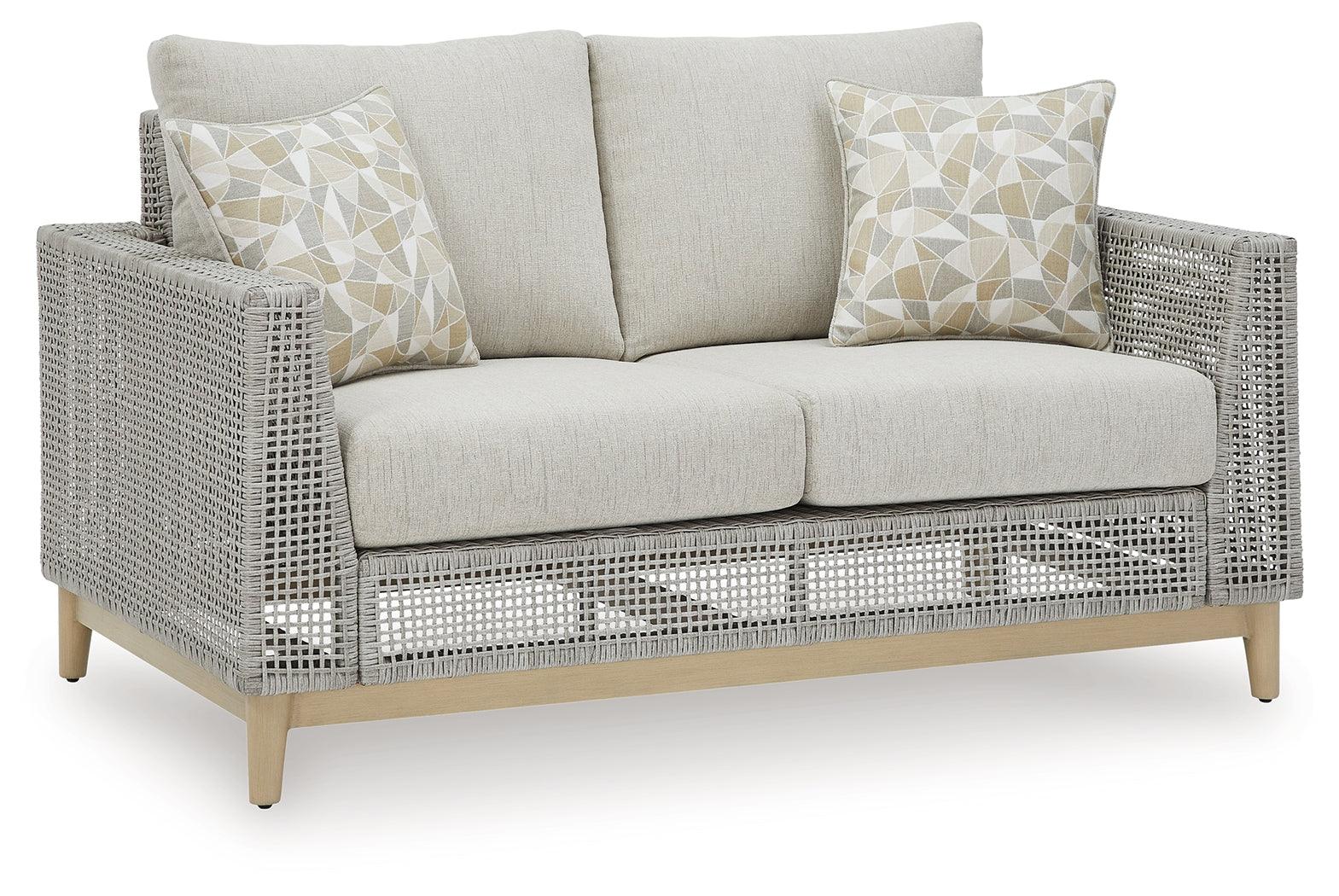 Seton Creek gray outdoor loveseat with cushion side view