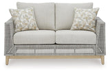 Seton Creek gray outdoor loveseat with cushion head-on view