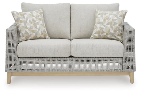 Seton Creek gray outdoor loveseat with cushion head-on view