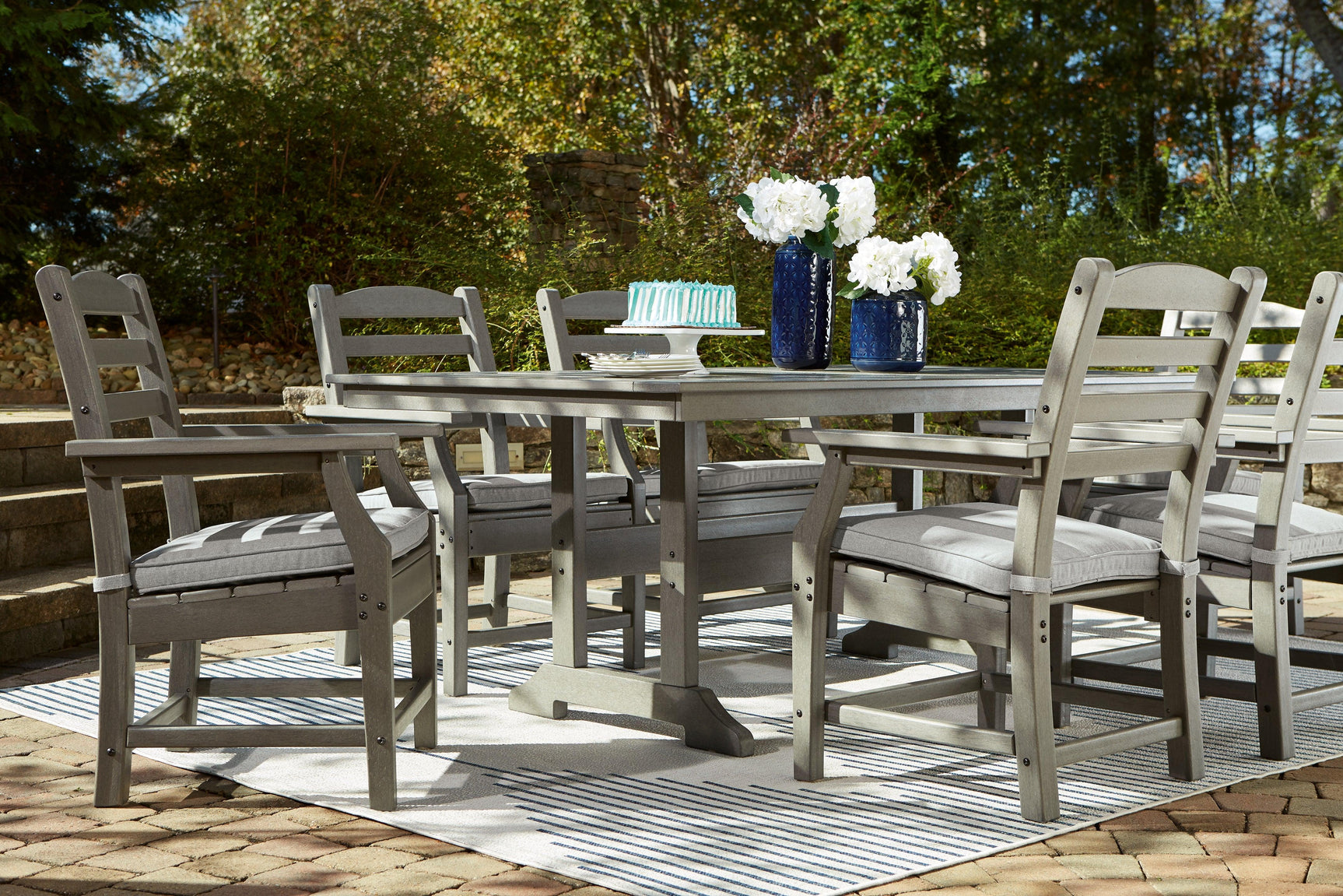 Visola Gray Outdoor Dining Table set in outdoor patio scene A