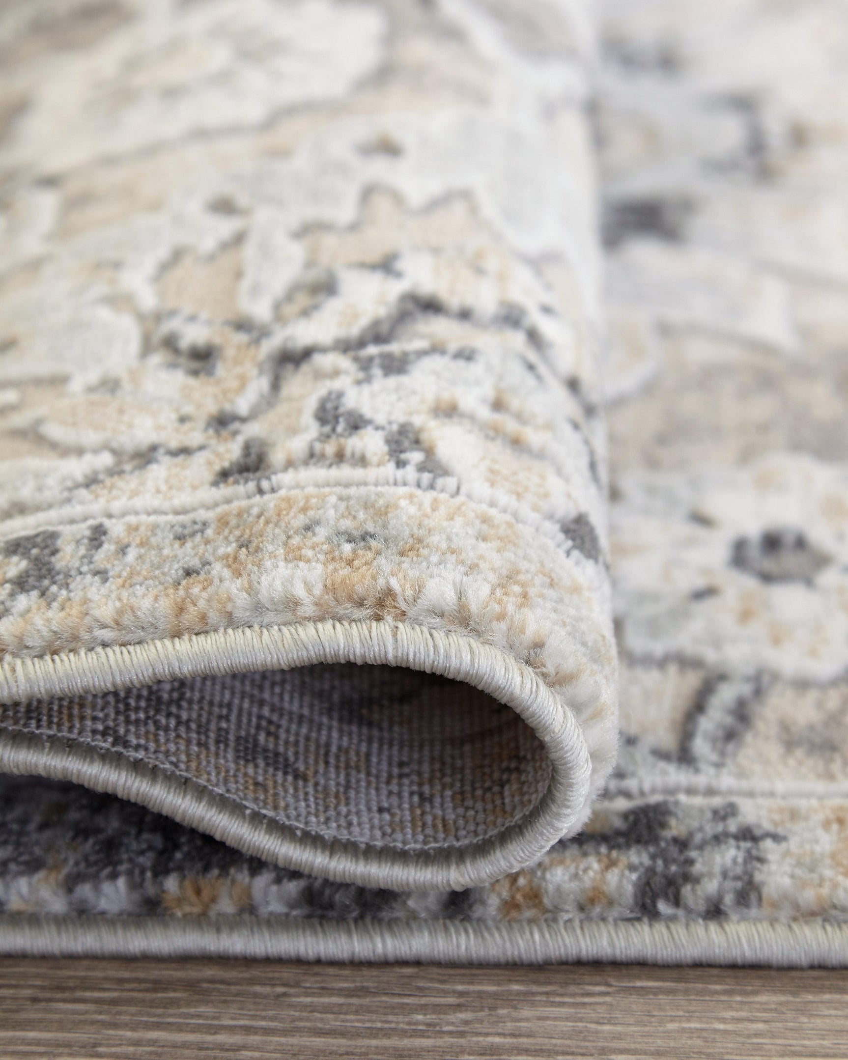Kilkenny Multi 7x10 Rug rolled detail highlighting fabric and backing