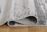 Rolled Abanett Multi 5'3" x 7'3" rug with visible pattern