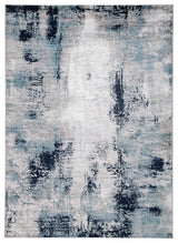 Close-up detail of Leonelle rug’s abstract pattern in white, blue, and gray