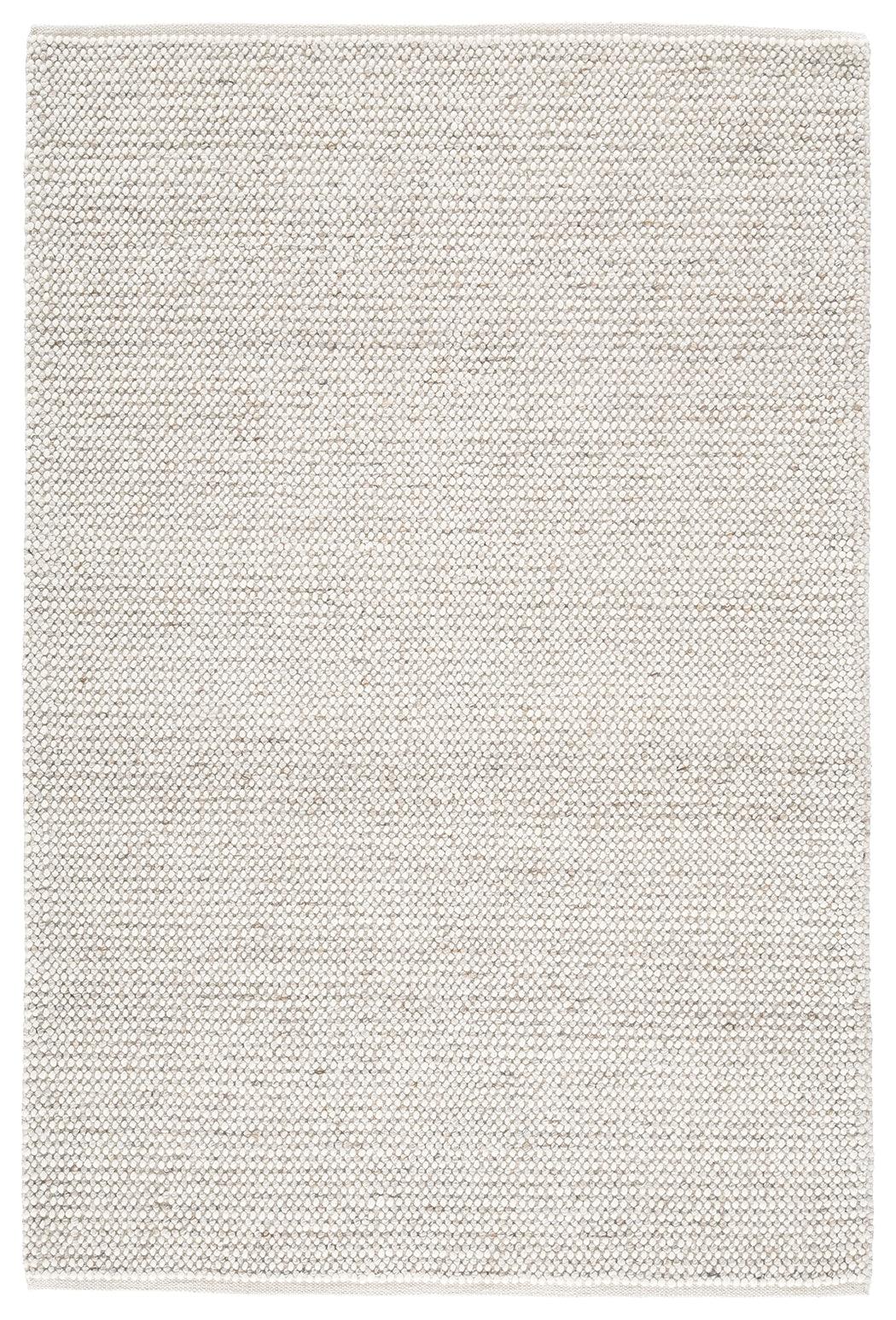 Close-up of Jossick rug's handwoven cream and taupe fibers