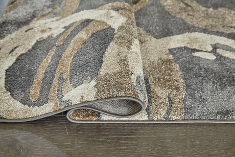 Rolled view of Faelyn Multi 5' x 7'3" area rug showing thickness and backing