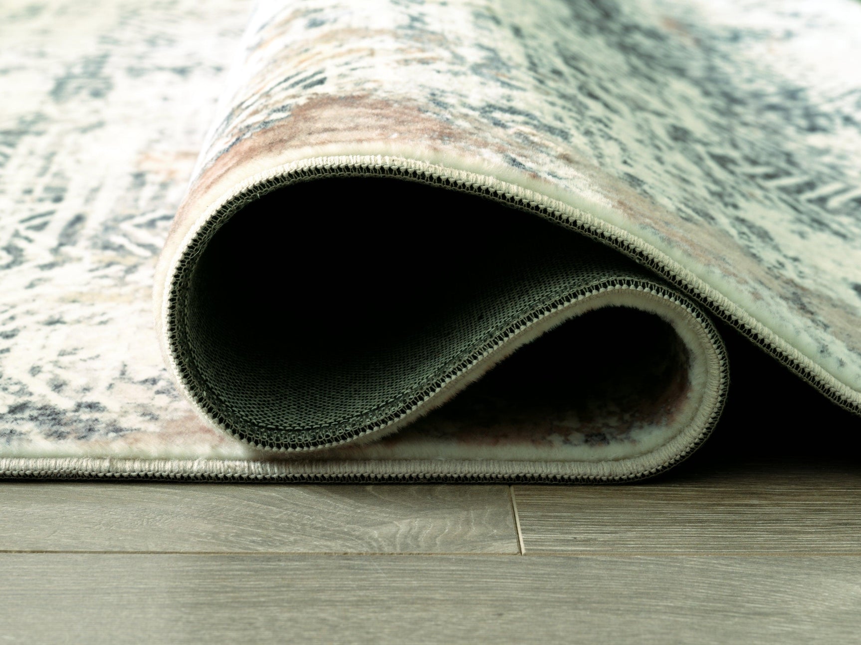 Rolled view of Redlings Multi 7'5" x 9'6" rug