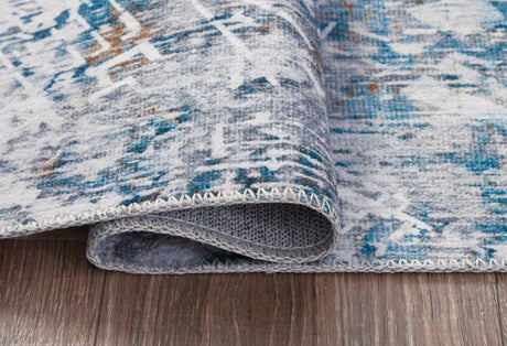 Garyard Multi 5x7 rug side view showing thickness and edge