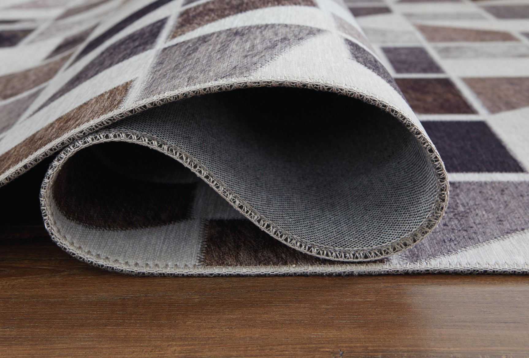 Rolled detail view of Jettner Multi rug
