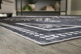 Close-up of Arloman black cream gray rug geometric pattern
