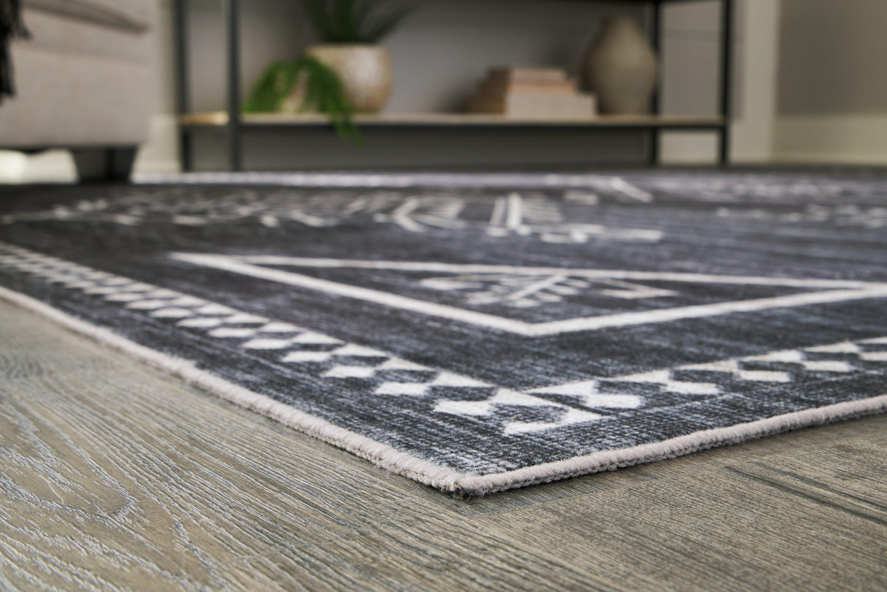 Close-up of Arloman black cream gray rug geometric pattern