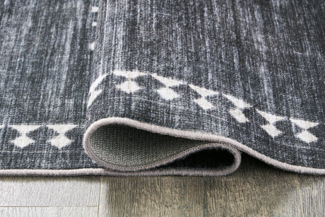Rolled detail of Arloman black cream gray 5x7 rug
