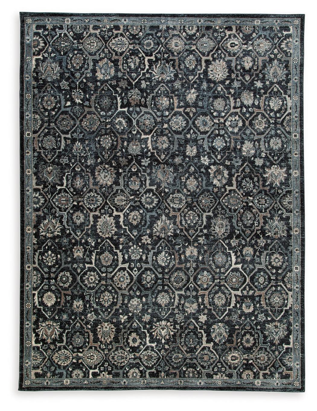 Hilcott close-up of floral pattern on blue cream brown rug