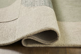 Rolled edge detail of Dallane blue green wool rug