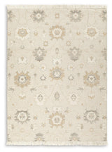 Close-up of Calkin floral pattern on linen gray caramel rug