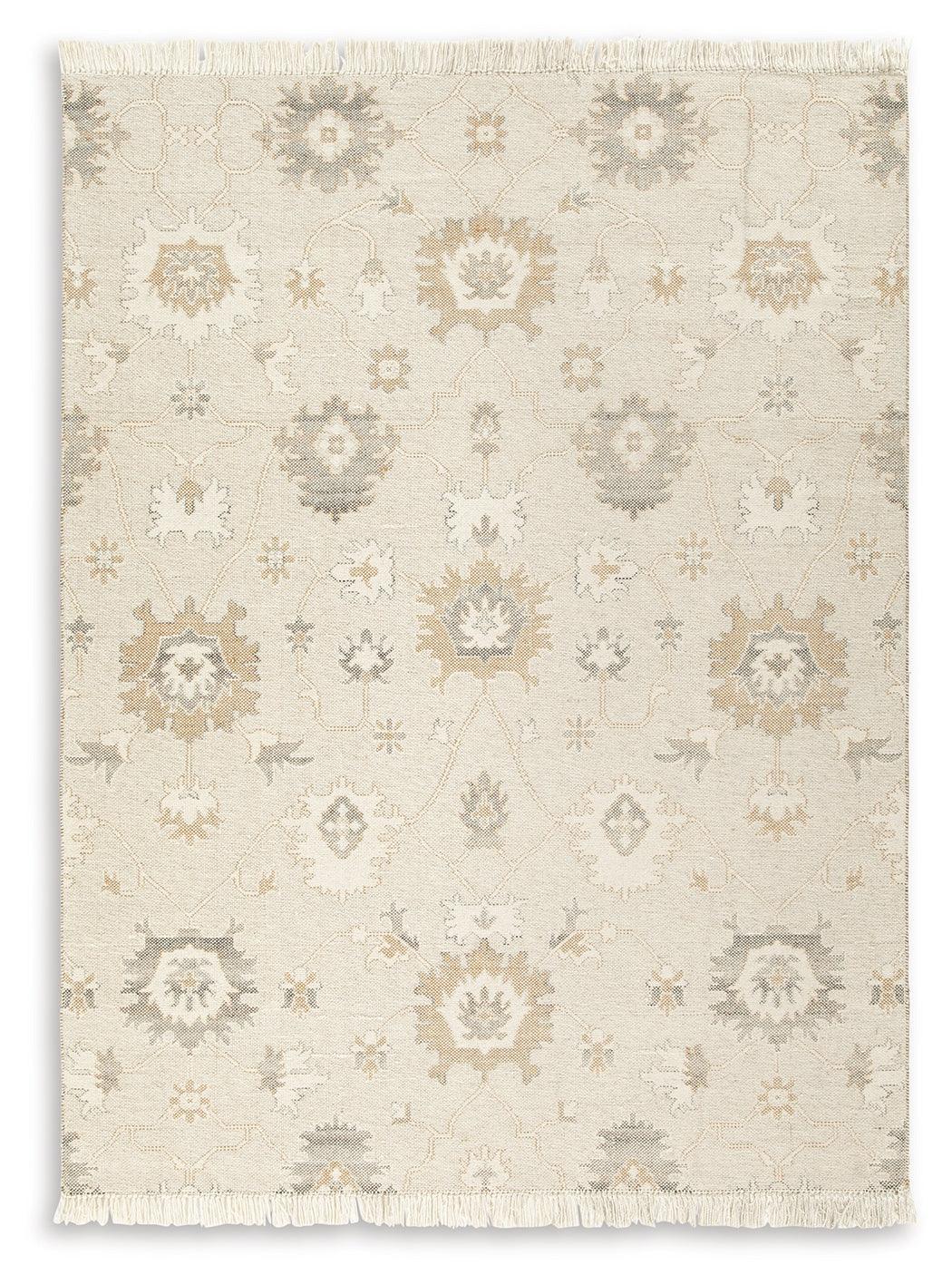 Close-up of Calkin floral pattern on linen gray caramel rug