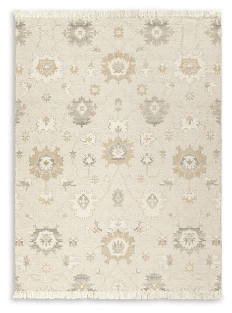 Close-up of Calkin floral pattern on linen gray caramel rug