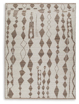 Close-up of Brettler rug corner showing fabric texture and geometric abstract design