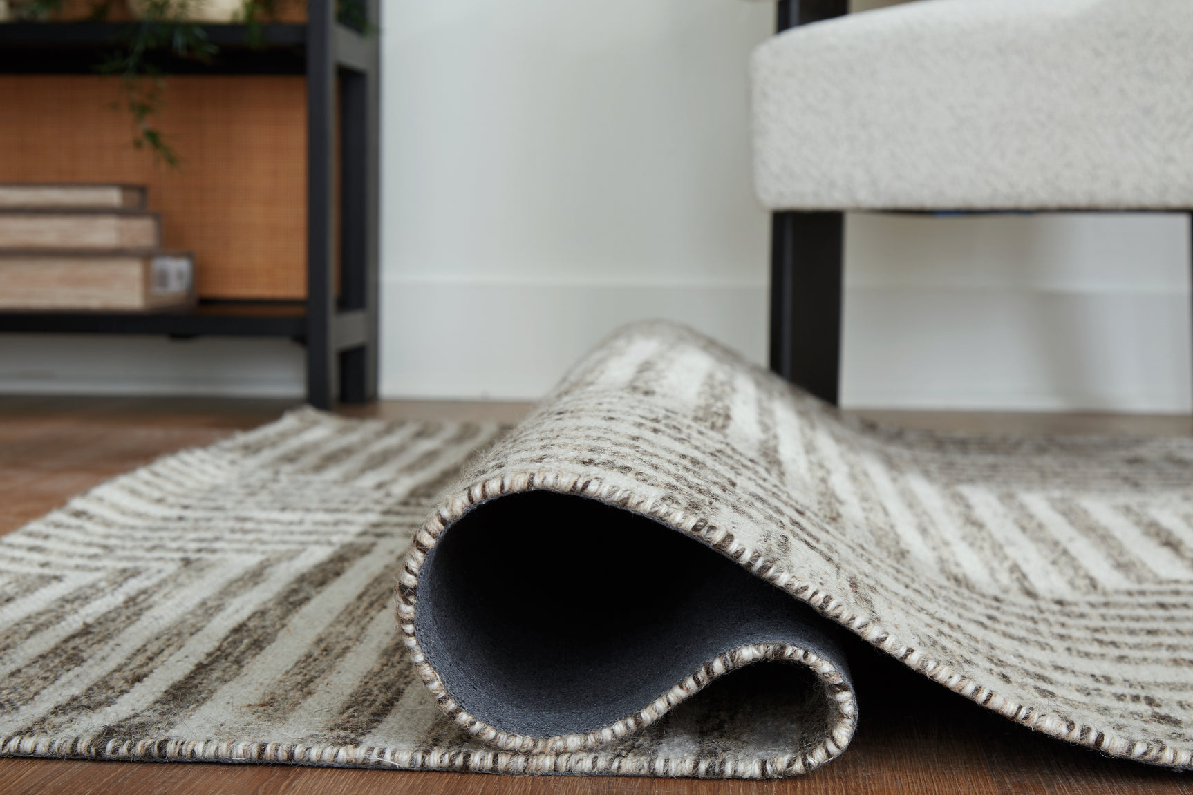 Rolled view of Jossen 8x10 geometric wool blend rug