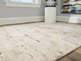 Kasney Rug rolled view showcasing thickness