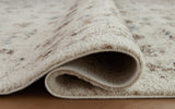 Rolled edge detail of Jossler ivory brown teal rug