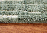 Close-up of the teal and white abstract striped pattern on the Cayworth rug