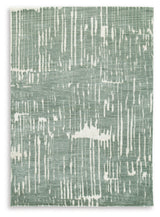 Rolled Cayworth teal white rug showing material texture