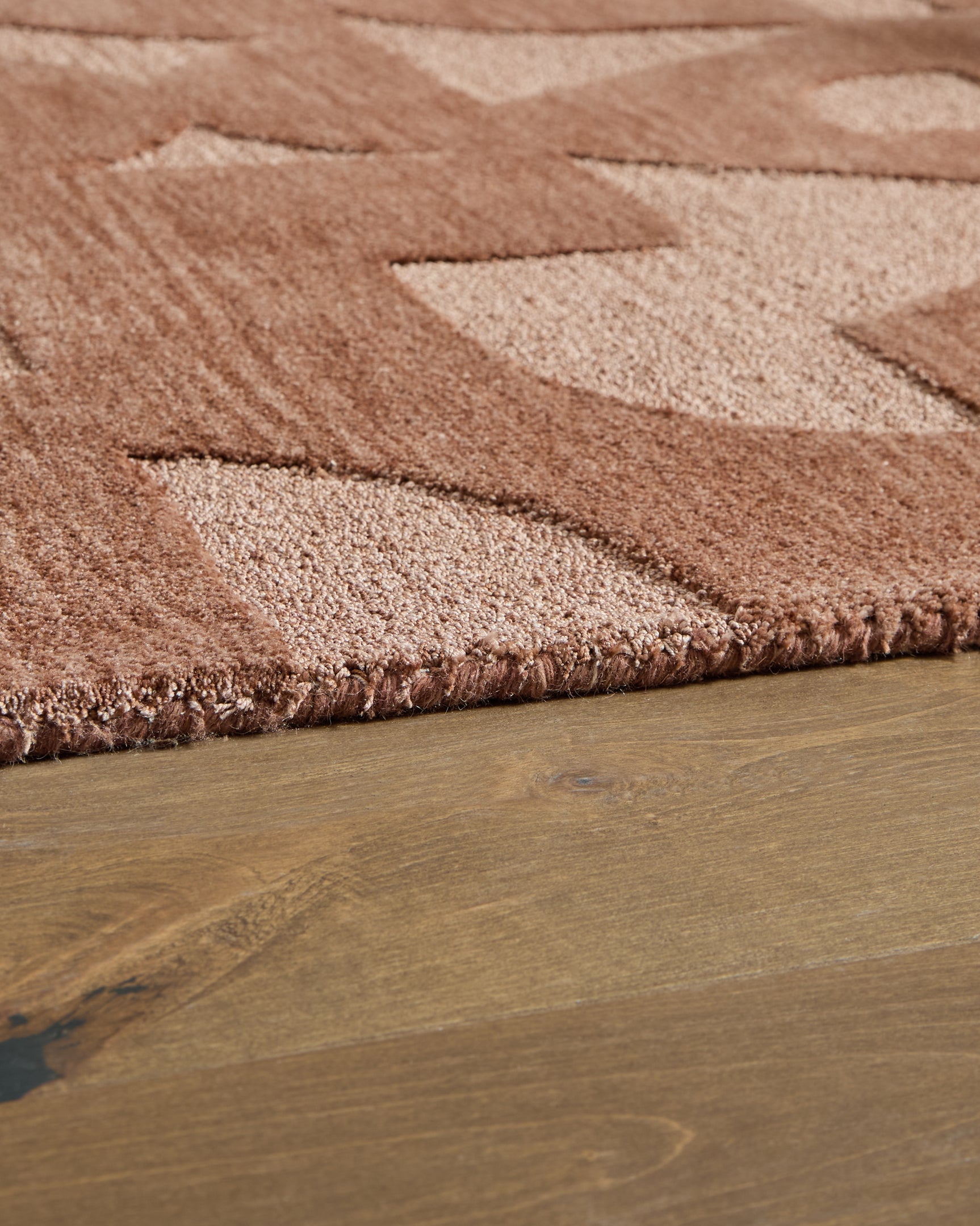 Side angle of rolled Perrenton Clay 8x10 rug