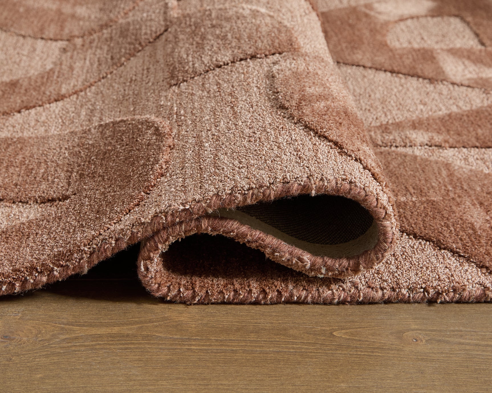 Perrenton Clay 5' x 7' rug corner showing pile and backing