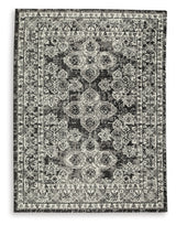 Close-up detail of Glennisman Medium Rug weave and botanical design